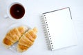 Croissant cup coffee white book Royalty Free Stock Photo