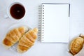 Croissant cup coffee white book Royalty Free Stock Photo