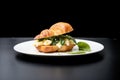 croissant filled with egg, spinach, and feta cheese on white background