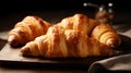 A croissant, golden-brown, flaky pastry, buttery aroma. Its layers are light, airy, and crispy