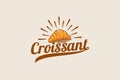 croissant logo with a combination of a croissant and beautiful lettering in vintage style