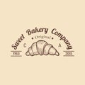 Croissant logo. Vintage bakery icon.Retro emblem of sweet cookie.Hipster pastry label.Biscuit sign. Desert illustration. Royalty Free Stock Photo