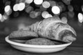 Croissant and oat cookies on white plate. Winter holiday tradition. Sweets for Santa Claus and his helpers. Santa treats Royalty Free Stock Photo