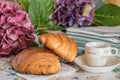 Croissant, pain au chocolat and coffee on a kitchen table Royalty Free Stock Photo