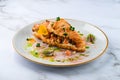 Croissants with soft cheese, salted salmon and green salad