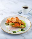 Croissants with soft cheese, salted salmon and green salad