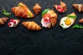 Croissant sandwich assortment. Various stuffed croissants, overhead