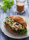 Croissant sandwich with chicken, cheese, cucumber Royalty Free Stock Photo