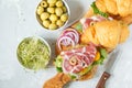 Croissant sandwich with ham, olives and vegetable Royalty Free Stock Photo