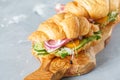 Croissant sandwich with ham, olives and vegetable Royalty Free Stock Photo