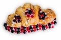 Croissant sandwiche with berries isolated on a white background