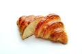 Croissant split into two parts on a white background Royalty Free Stock Photo