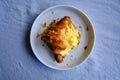 Croissant stuffed with scrambled eggs