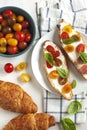 Croissant with tomato, basil and cream cheese. Royalty Free Stock Photo