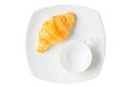 Croissant on white plate with blank mug isolated over white background with clipping path. Croissant french breakfast. Top view
