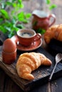 Croissant on a wooden cutting board Royalty Free Stock Photo