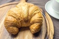 Croissant on woonden plate Royalty Free Stock Photo