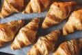 Croissants on baker's paper. Royalty Free Stock Photo