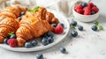 Croissants and berries on plate Royalty Free Stock Photo