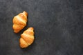 Croissants on a black concrete table. View from above