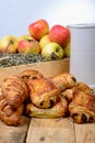 Croissants with a box of apples Royalty Free Stock Photo