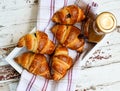 Croissants and caramel on the wooden tray