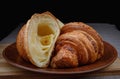 Croissants on a ceramic dish. Fresh pastries