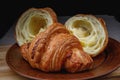 Croissants on a ceramic dish. Fresh pastries