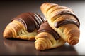 Croissants with chocolate on a dark background. Close-up.