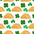 Croissants and Clover leaves seamless pattern. Lucky symbol background or Saint Patrick Day backdrop. Vector illustration Royalty Free Stock Photo
