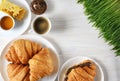 Croissants, coffee, honey, chocolate butter and sprouted wheat