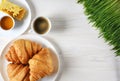 Croissants, coffee, honey and sprouted wheat