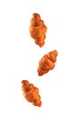 Croissants flying on pink background. Levitation scene