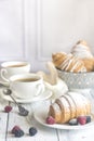 Croissants with fresh berries and two cups of coffee Royalty Free Stock Photo