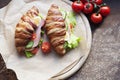 Croissants with ham, cheese, cucumber, egg and tomatoes Royalty Free Stock Photo