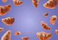 Croissants levitating or flying isolated on very peri purple background