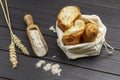 Croissants in linen bag. Flour in wooden scoop