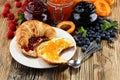 croissants with marmalade and assortment of jams, seasonal berries, apricot, mint and fruits Royalty Free Stock Photo