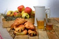 Croissants and pains au chocolat with a box of apples Royalty Free Stock Photo