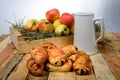 Croissants and pains au chocolat with a box of apples Royalty Free Stock Photo