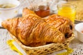 Croissants pastry for breakfast with tea and orange juice Royalty Free Stock Photo