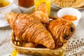 Croissants pastry for breakfast with tea and orange juice Royalty Free Stock Photo