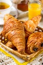 Croissants pastry for breakfast with tea and orange juice Royalty Free Stock Photo