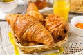 Croissants pastry for breakfast with tea and orange juice Royalty Free Stock Photo