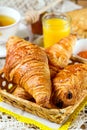 Croissants pastry for breakfast with tea and orange juice Royalty Free Stock Photo