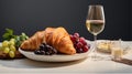 Croissants placed on white plate ready to serve with white wine and red grapes, studio light, studio background. Generative ai. Royalty Free Stock Photo