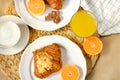 Coffee with croissants, pieces of chocolate, orange juice and tangerines for breakfast Royalty Free Stock Photo