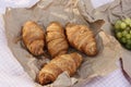 Croissants strawberries and grapes on a picnic Royalty Free Stock Photo