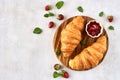 Croissants With Strawberry Jam On Wooden Board. Top View With Copy Space