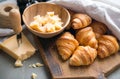 Croissants whit delicious cheese and grapes for tasty breakfast. Original tasty French croissants with cheese and on the Royalty Free Stock Photo